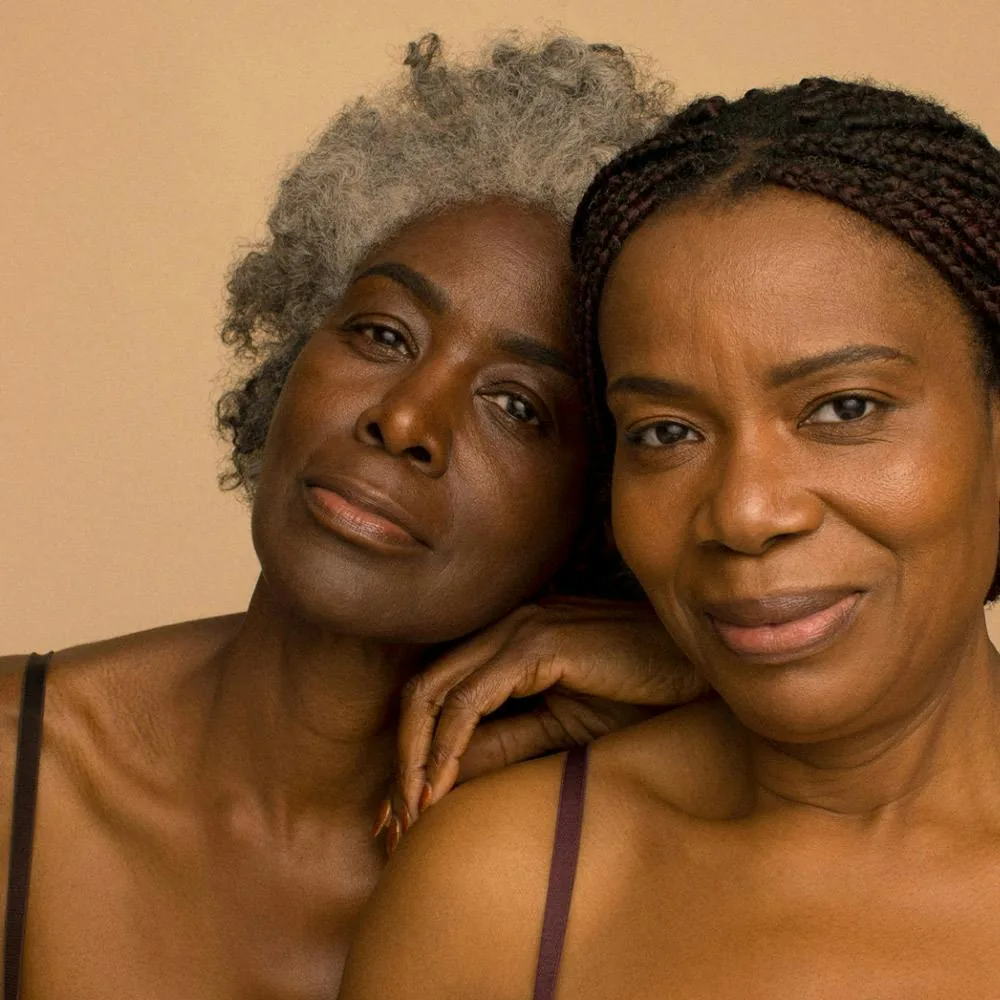 Group of women smiling together, representing the Mama Bear Wellness community